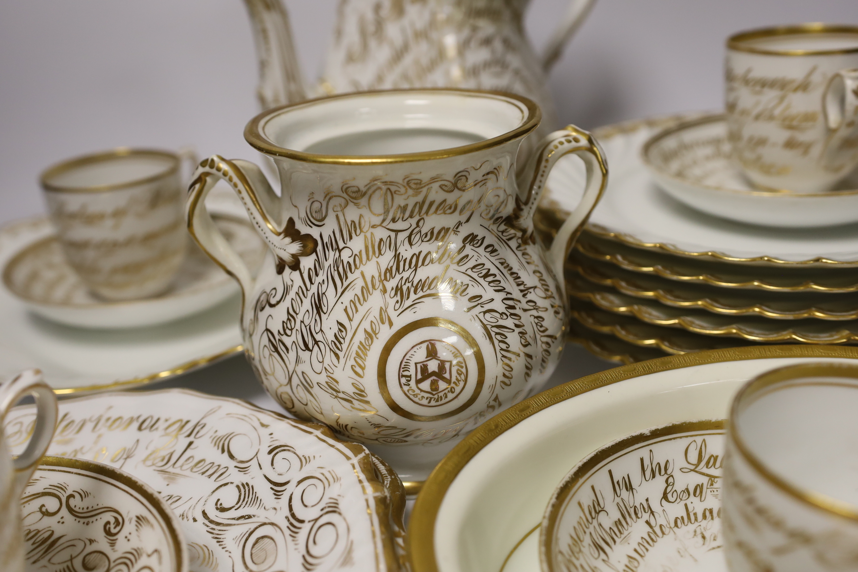 A mid-19th century English bone china part tea service, possibly Davenport, with applied gilt presentation to the Liberal politician G. H. Whalley (16 pieces), teapot 24.5cm together with Limoges plates